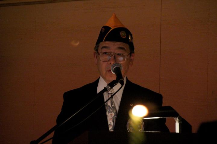 前会長L田畑隆章が「ライオンと呼ばるる人」を朗読。